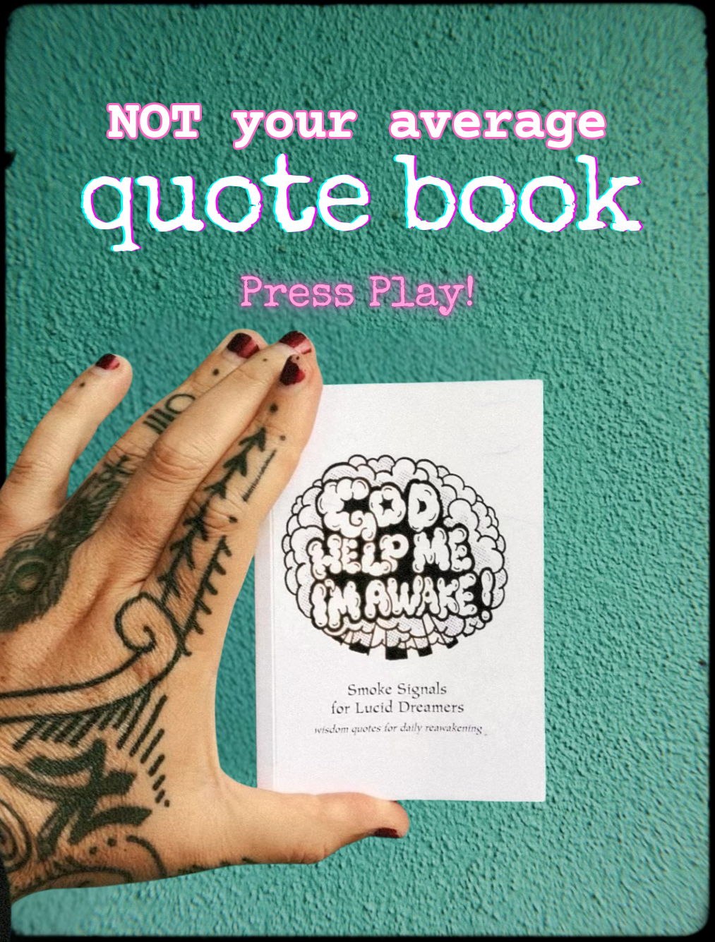 A tatood hand holding an indie quote book and rolling dice 
